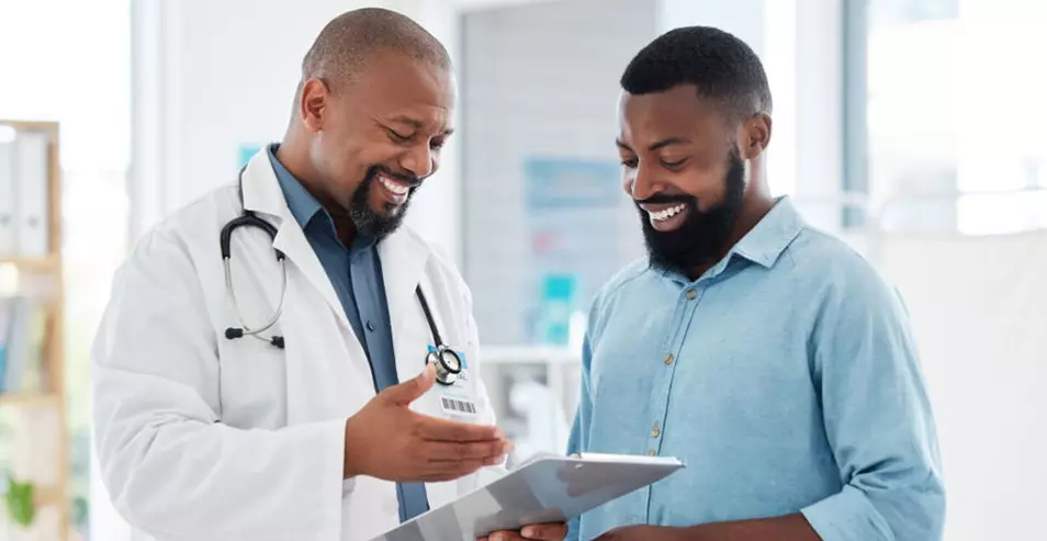 doctor with patient smiling